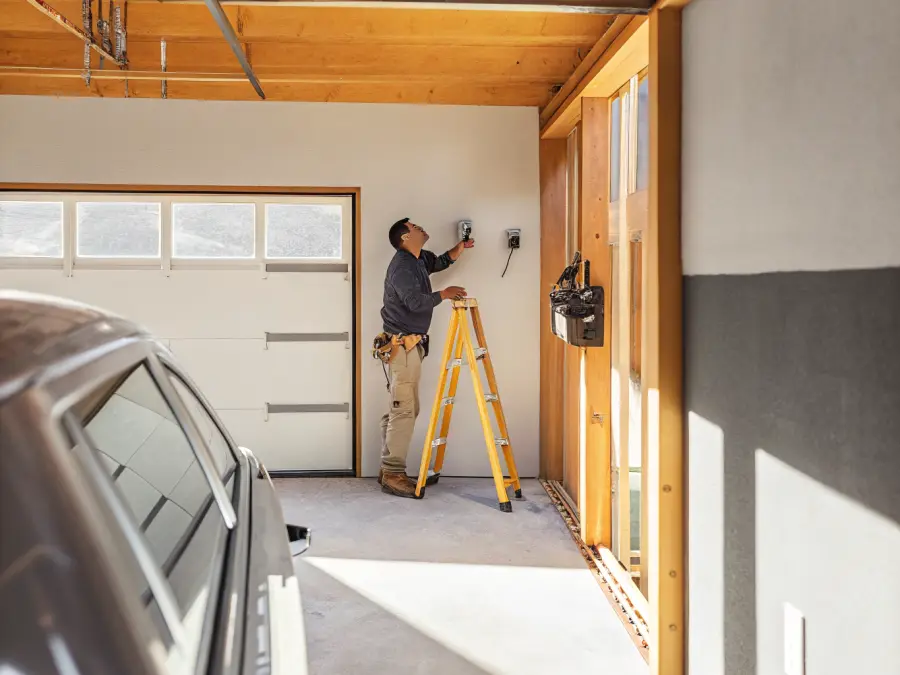 Level 2 EV charger mounted on a garage wall